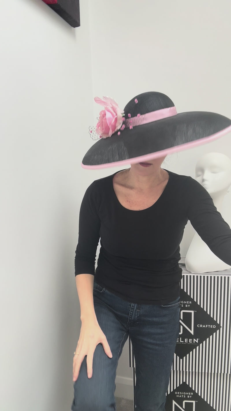 milliner wearing wide brim sior style at for royal ascot, ladies day or best dressed lady hst