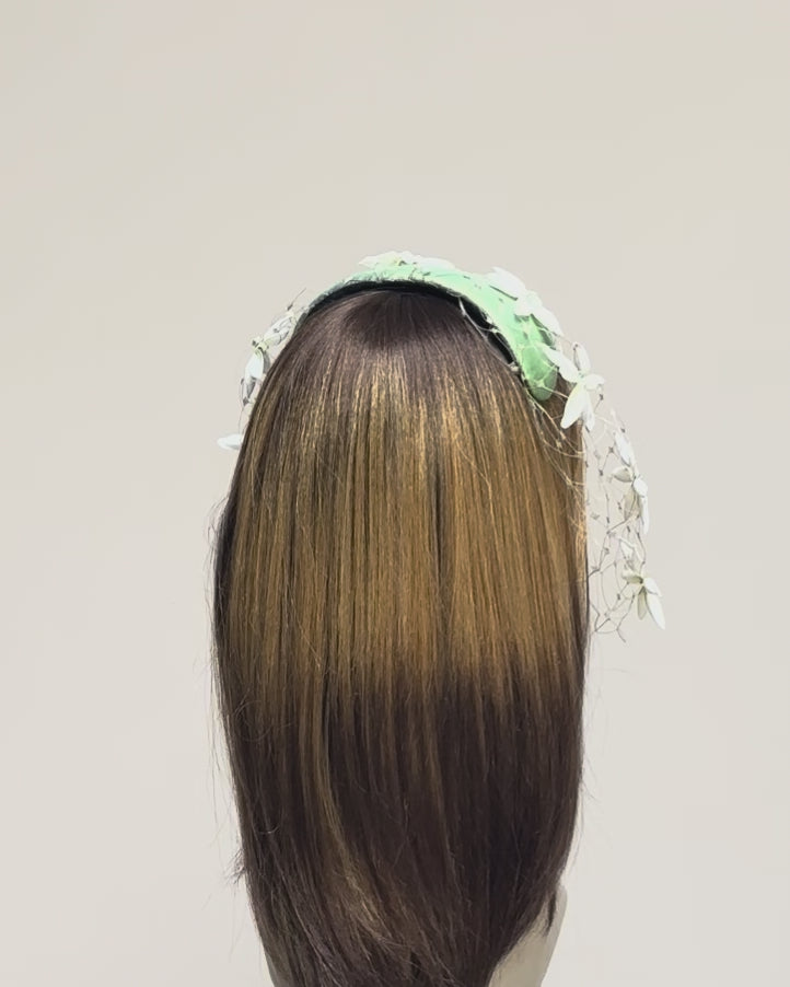 Full video view of boho chic floral headpiece with birdcage veil, vintage inspired millinery